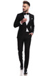 © Viorel Sima - man in tuxedo wearing ring, walks and looks to side