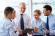 © Syda Productions - business team with tablet pc computer at office