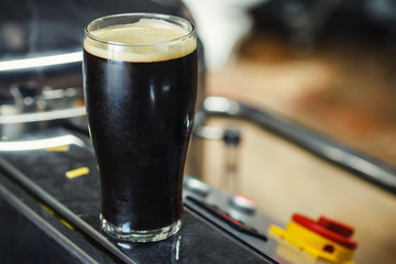 Wall Mural - Pint of stout in a brewery