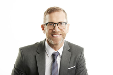 Sticker - Smiling businessman portrait. Successful senior manager business man wearing suit while standing against at isolated white background. 