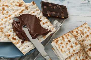 Matzah bread with chocolate cream and knife