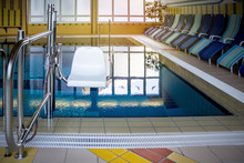 Chair lift in swimming pool for disabled people