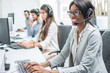 © Bojan - Smiling young woman with headset working in call center.