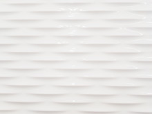 Abstract Background Of White Smooth And Sleek Wall With Embossed Pattern.