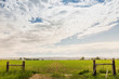 © Connect Images - Bright cloudscape over flat rural landscape, Montana, US