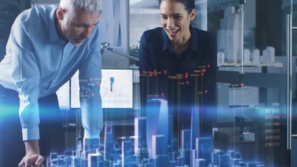Male and Female Architects Work with Holographic Augmented Reality 3D City Model. Technologically Advanced Office Professional People Use Virtual Reality Modeling Software Application.