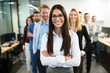 © NDABCREATIVITY - Portrait of business team posing in office