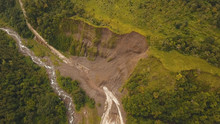 Landslides And Rockfalls On The Road In The Mountains, Camiguin. Aerial View: Mud And Rocks Blocking The Road. Destroyed Rural Road Landslide Damaged In Powerful Flood. Collapsed On The Mountain