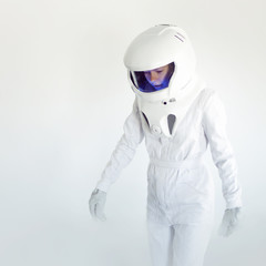 Wall Mural - Fantastic space suit walk alone in empty. Astronaut on white background