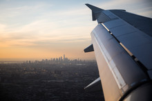 A View Of New York City Over A Plane Wing