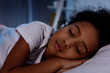 © LIGHTFIELD STUDIOS - adorable african american kid sleeping in bed at home