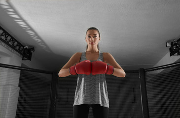 Poster - Portrait of young female boxer in gym