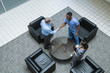 © FS Productions/Blend Images - Doctor and nurse shaking hands in lobby