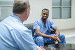 © FS Productions/Blend Images - Doctor and nurse talking in lobby