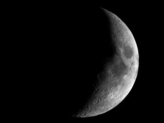 Wall Mural - high contrast waxing crescent moon seen with telescope