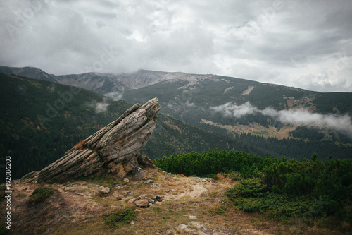 Fotografie, Obraz Strange rocks in mountains in cloudy day