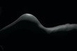 © FotoGroupMedia - Silhouette of a body part , nude woman isolated on black background