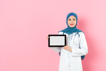 Wall Mural - woman muslim doctor showing mobile pad computer