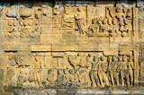 Fototapeta Miasto - Decorated stone with bas reliefs in the Borobudur temple in Yogyakarta, Java, Indonesia.
