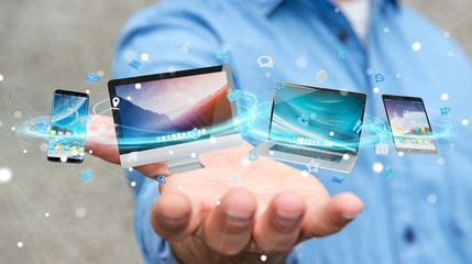 Wall Mural - businessman connecting tech devices and icons applications 3d rendering