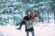© Dmitriy Shipilov - loving couple having fun in the snowy forest
