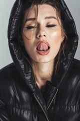 Canvas Print - Sexy fashion young stylish woman licking her lips.