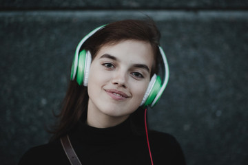 Young pretty smiling woman girl portrait with headphones