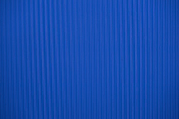 Wall Mural - Dark blue colored corrugated cardboard texture useful as a background