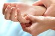 © karelnoppe - Therapist manipulating sensitive area on hand.