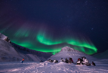 Wall Mural - the polar arctic northern lights aurora borealis sky star in norway svalbard in longyearbyen city sn
