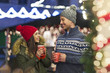 © pikselstock - Young Couple Having Fun Outdoors At Christmas Time