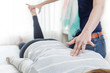 © RichTphoto - Therapist giving Kinesiology treatment.