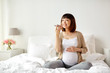 © Syda Productions - pregnant woman using voice recorder on smartphone