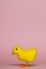 Wall Mural - Easter chick on a pastel pink background