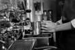 © Vuttigrai - The professional barista is a make Cup of coffee latte in coffee shop, black and white tone