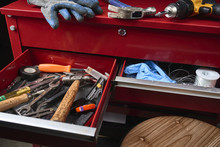 An Assortment Of Tools In Drawers In A Workshop