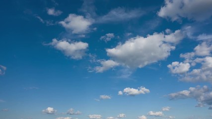 Wall Mural - Beautiful clouds flying in blue sky, timelapse.