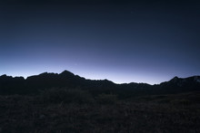 View Of Silhouette Mountain Against Blue Sky At Night