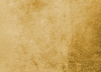 gold velvet background or golden yellow velour flannel texture made of cotton or wool with soft fluf