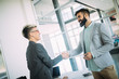 © NDABCREATIVITY - Picture of business colleagues talking in office