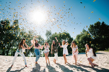 Beautiful Happy Stylish Sexy Young Girls Stand In Beach And Opens Colored Confetti On Background Nature. Party  Style Boho. Maiden Evening Hen-parties. Bachelorette. Close Up. Portrait. Place For Text