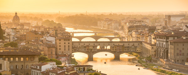 Fototapete - Panoramic aerial view of Florence at sunset  with the Ponte Vecchio and the Arno river, Tuscany, Italy