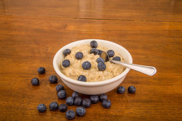 Wall Mural - Blueberries on Oatmeal with Spoon