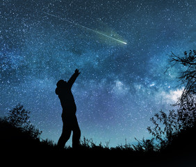 Wall Mural - man watching the stars in night sky