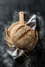 Bakery - Round Loaf Of Rustic Bread On Black Background