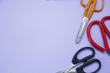 Home, House Repair, Redecorating, Renovating Concept. A set of repair tools on a blue grid: three scissors, top view, flat lay