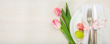 Easter Table Setting With Pink Tulips On White Wooden Background. Top View, Copy Space, Banner