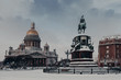 Outdoor view of St Isaac`s Cathedral and Monument to Nicholas I in Saint Petersburg, Russia, covered with snow. Famous landmarks of city. Sightseeing and traveling concept