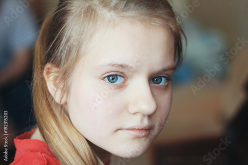 Girl Teenager At Home Portrait Of A Blonde Hair Blue Eyes Female