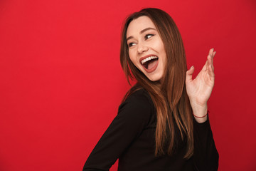 Poster - Woman standing isolated over red background